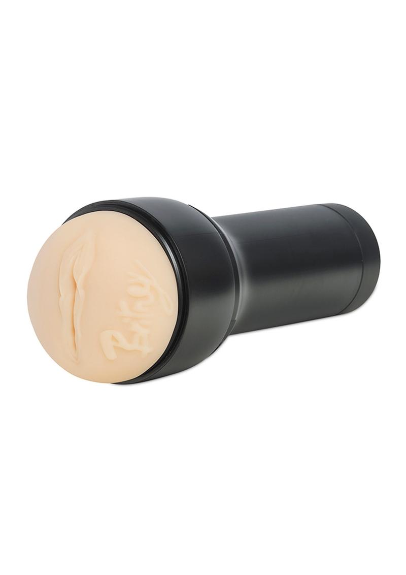 A sleek black and vanilla interactive pussy masturbator - Kiiroo Feel Britney Amber Stroker. Designed for immersive pleasure with interactive capabilities. Enhance your intimate experiences like never before. USB-rechargeable, ergonomic design for effortless use and cleaning. Perfect for intimate date nights or solo play.